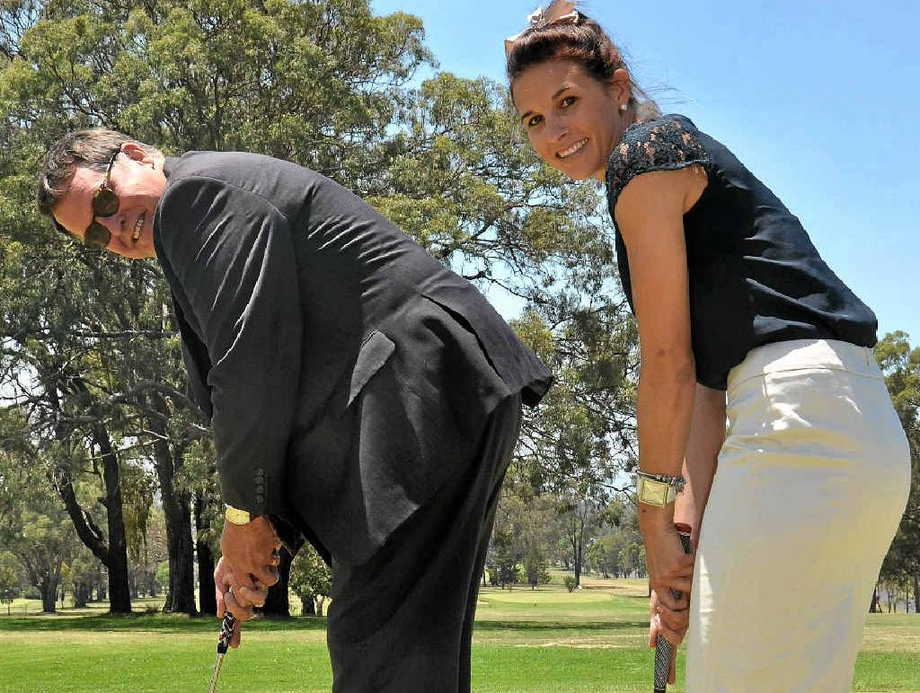 GREEN OPENING: Queensland Sport and Recreation regional manager Garry Humphries and advisor Caitlin McBaron practise their putting at the opening of the Warwick Golf Club’s new greens yesterday. GREEN OPENING: Queensland Sport and Recreation regional manager Garry Humphries and advisor Caitlin McBaron practise their putting at the opening of the Warwick Golf Club’s new greens yesterday.